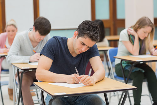 man taking paper exam