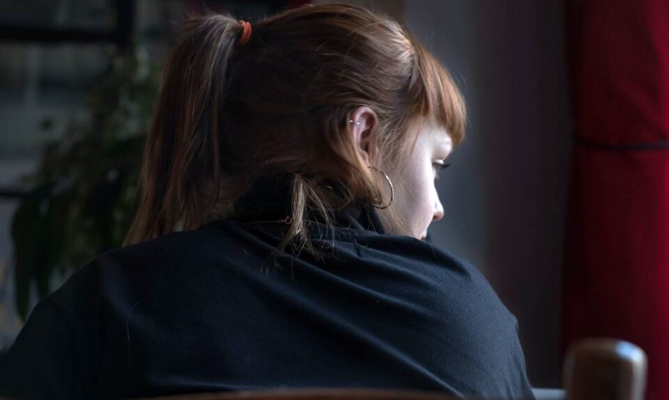 lady in black clothing looking away